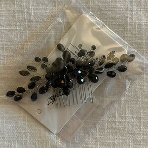 Small black and silver beaded comb.